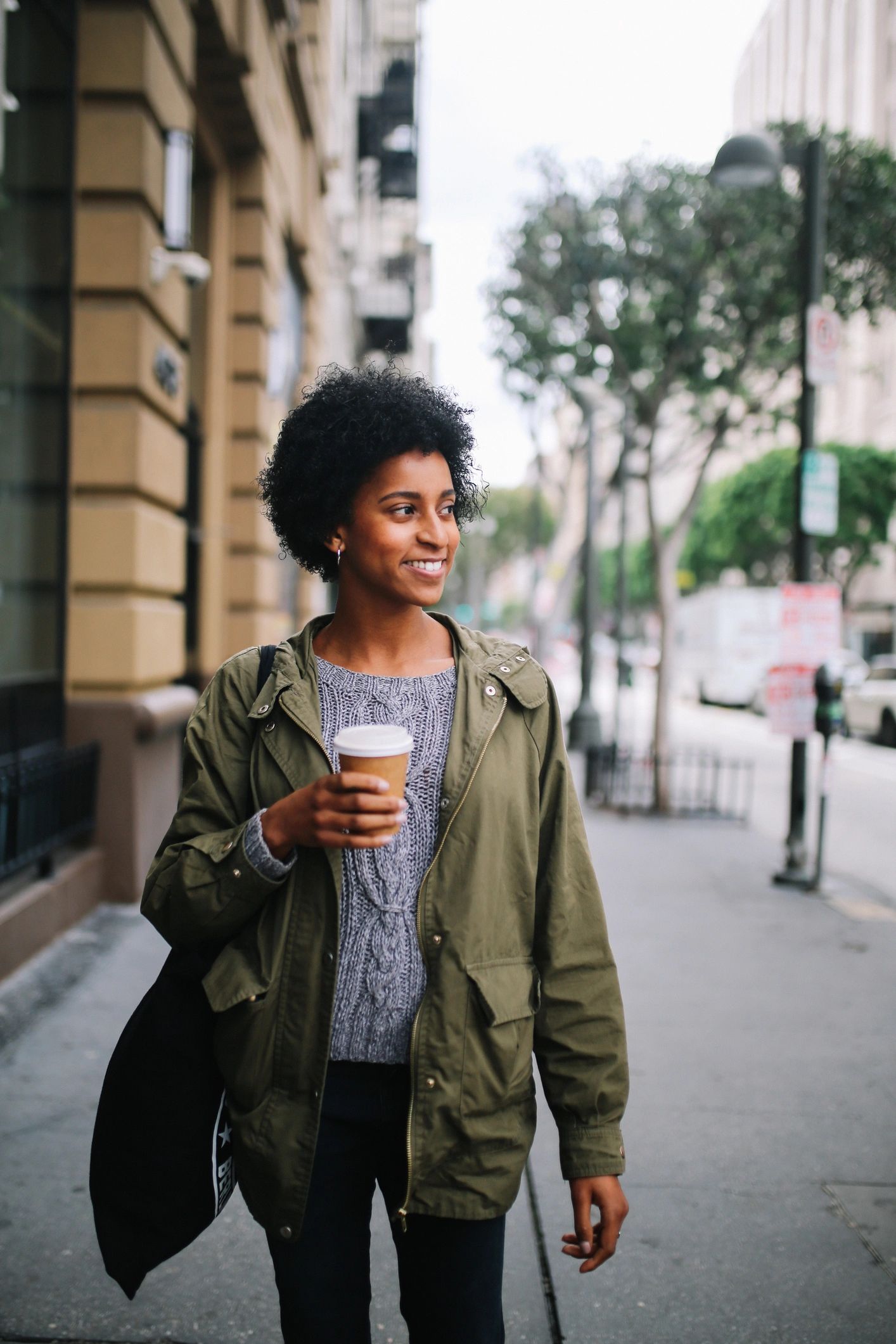 Young woman walking through downtown Los Angeles