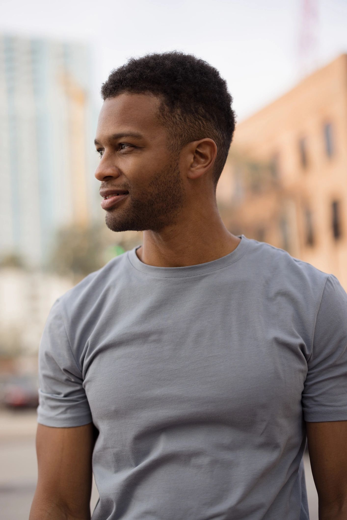 Young man smiling in an urban environment